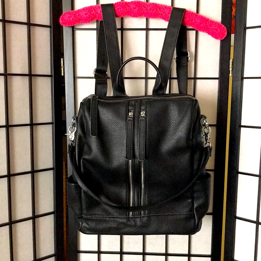 Excellent Used Condition Black leather backpack. Adjustable straps.